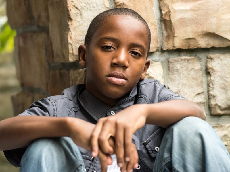 young boy sitting