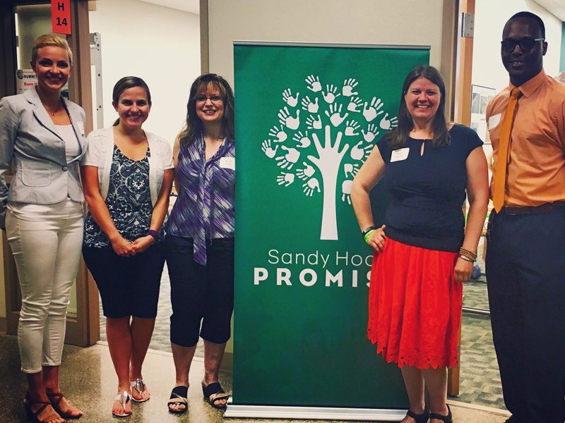 Lauren Mechling (far left) with Sandy Hook Promise staff Annie Stephens and Andre Elliott (both far right).