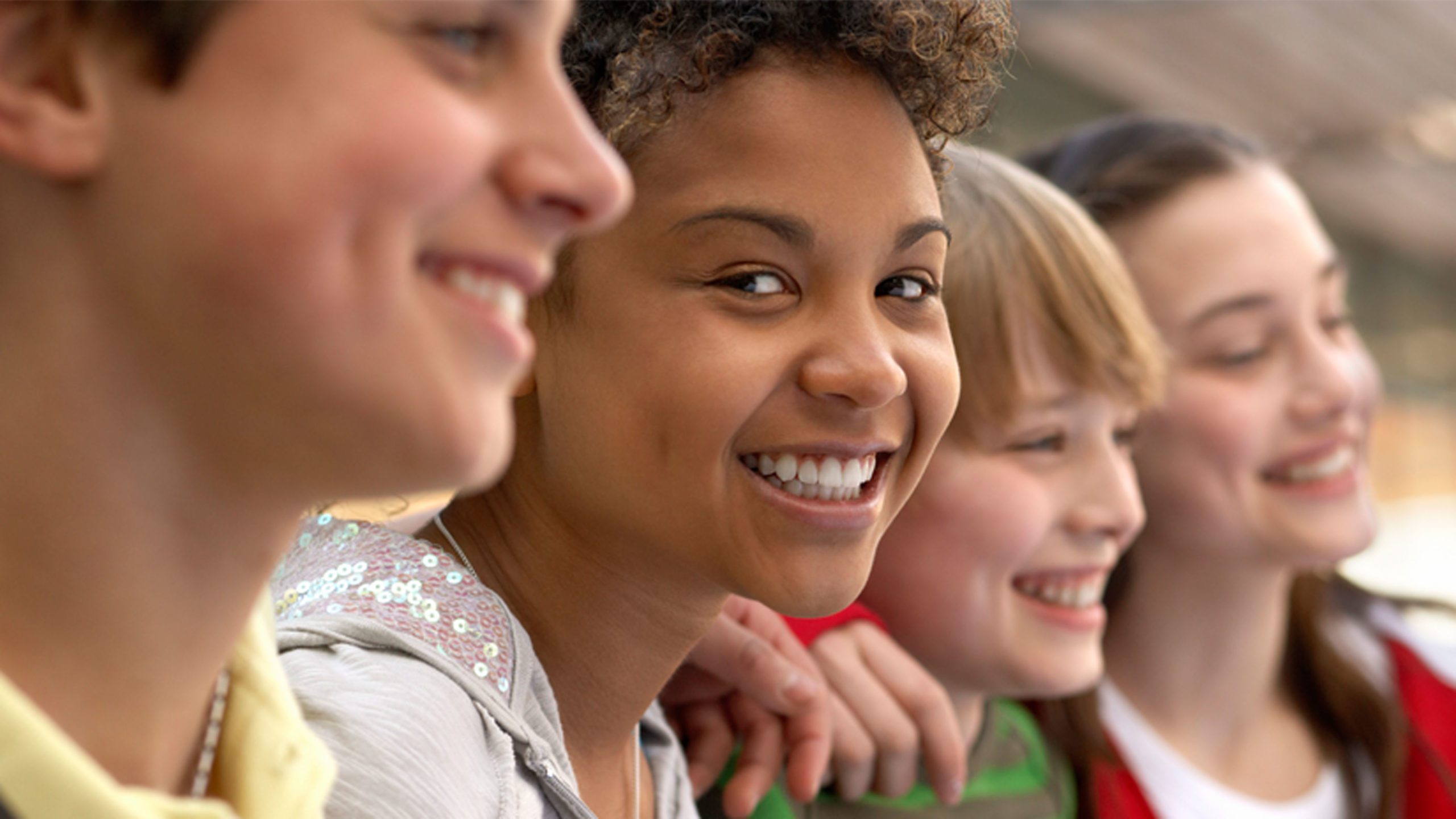 Line of student faces smiling