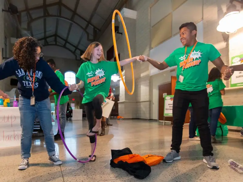 SAVE Promise Club team using hula hoops