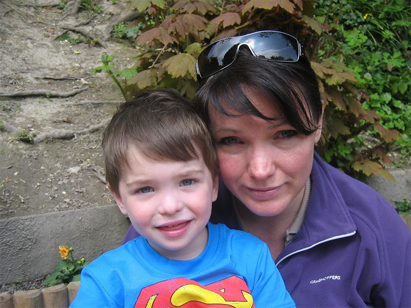 Nicole Hockley holds her son, Dylan wearing his superman t-shirt.