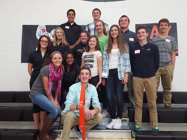 A diverse group of students celebrate Say Something in their school gymnasium. These students from Chardon High School were among the first in Ohio to hold Say Something, back when the program launched in 2015.