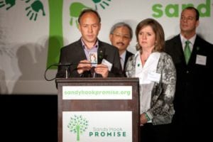 Mark Barden standing at a podium.