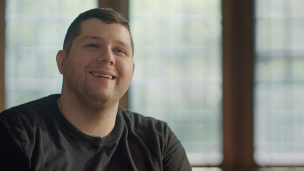 Nick Walczak from Chardon, Ohio sits in a wheelchair by a window. In 2012, he was shot three times. Paralyzed from waist down.