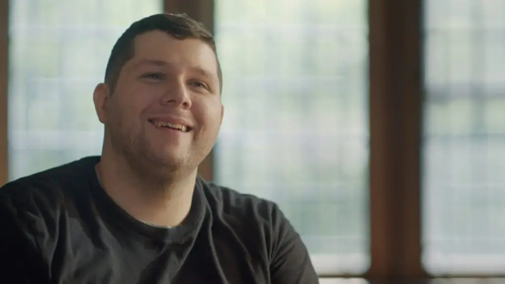 Nick Walczak from Chardon, Ohio sits in a wheelchair by a window. In 2012, he was shot three times. Paralyzed from waist down.