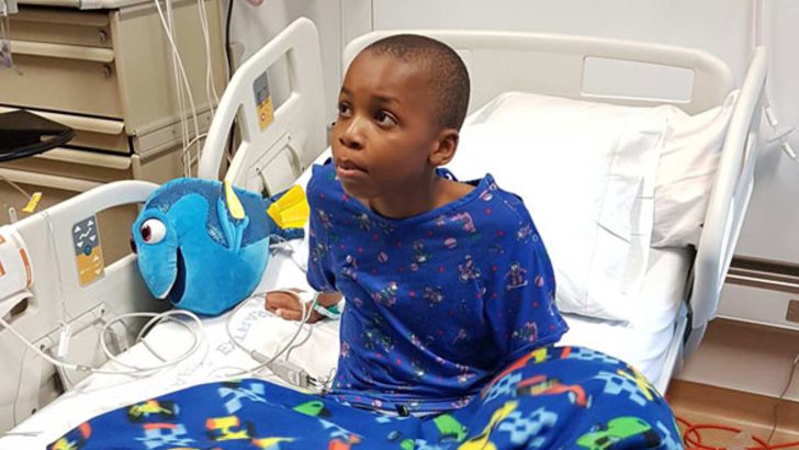 Nolan sits in a hospital bed after he was shot in San Bernadino, California in 2017. The bullet broke two of his ribs and lacerated portions of his kidney and liver.