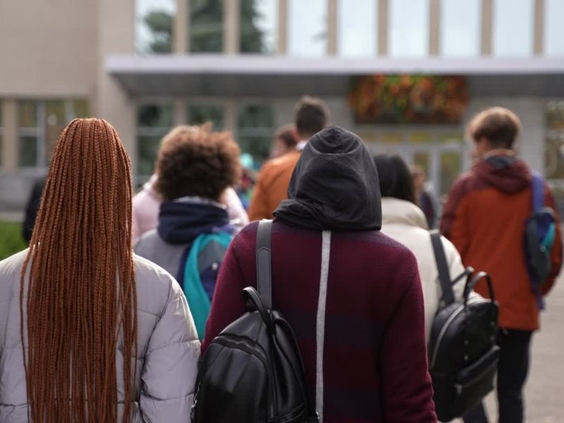 Group of hight school students walking to school