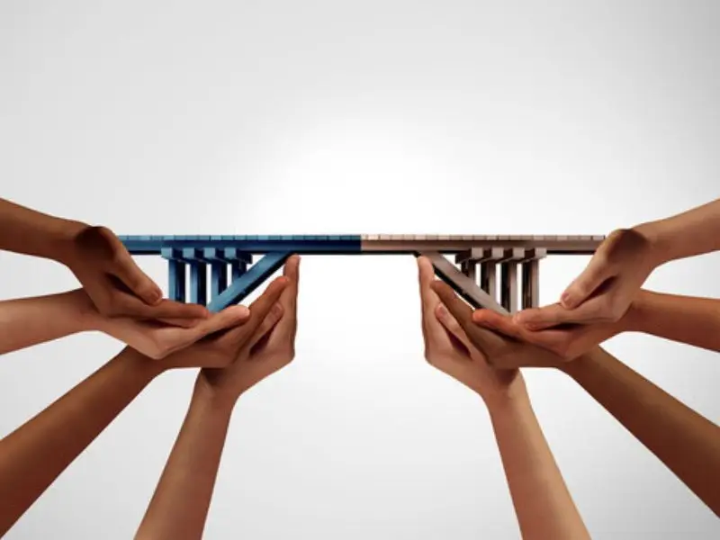 Hands creating a bridge