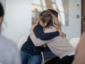 Hugs during a group therapy class