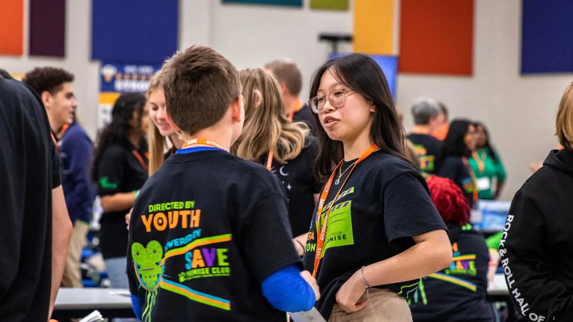Two students speaking at an event